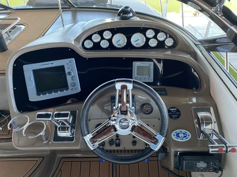 Slide: The Image of 2006 Regal Commodore 3560 IB dashboard with steering wheel, gauges, and navigation equipment. - 17