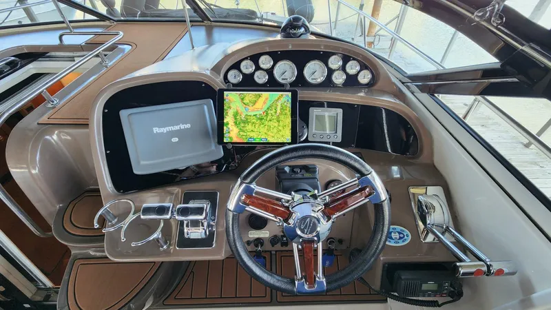Slide: The Image of 2006 Regal Commodore 3560 IB helm with navigation screens and controls. - 22