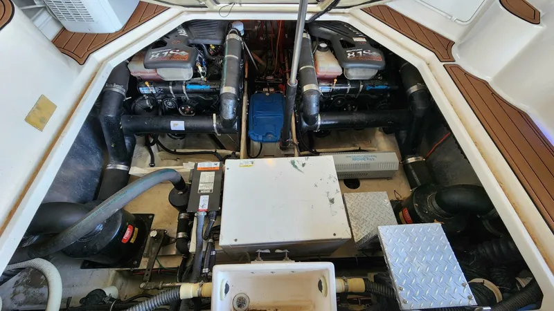 Slide: The Image of Engine compartment of 2006 Regal Commodore 3560 IB with dual engines and mechanical components. - 25