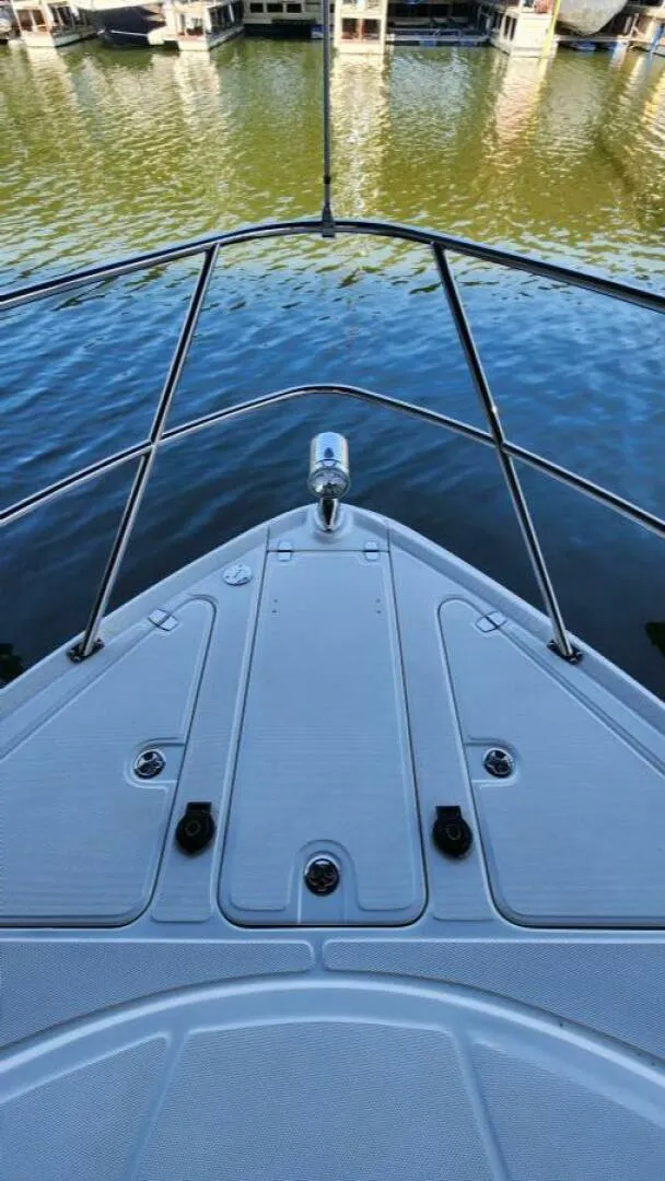 Slide: The Image of 2006 Regal Commodore 3560 IB boat bow view at marina. - 30