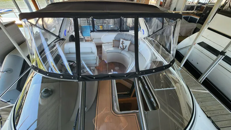 Slide: The Image of 2006 Regal Commodore 3560 IB yacht with spacious seating and clear canopy. - 33