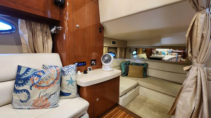 Slide: The Image of Interior of 2006 Regal Commodore 3560 IB yacht with cozy seating and nautical decor. - 5