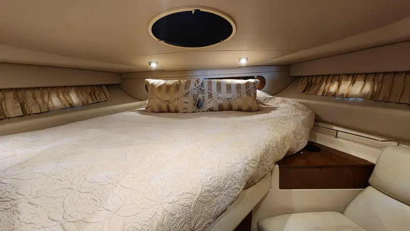 Slide: The Image of Luxurious cabin interior of 2006 Regal Commodore 3560 IB yacht with cozy bedding. - 8
