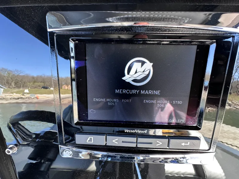Slide: The Image of Mercury Marine display on 2017 Sunsation 32 CCX boat, showing engine hours and controls. - 14