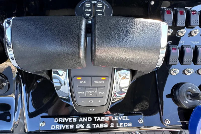 Slide: The Image of Control panel of a 2017 Sunsation 32 CCX boat with throttle and switches. - 16
