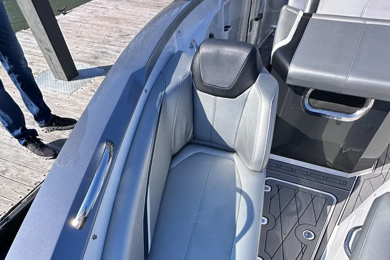 Slide: The Image of 2017 Sunsation 32 CCX boat interior with gray seating and sleek design. - 23
