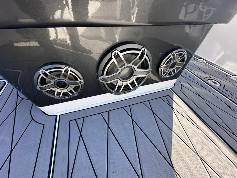 Slide: The Image of 2017 Sunsation 32 CCX boat speakers on sleek, modern deck. - 24