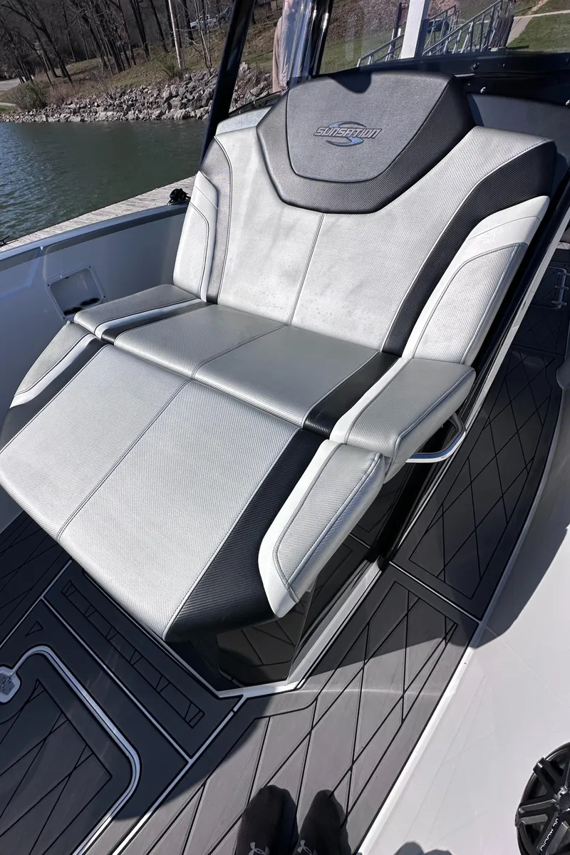 Slide: The Image of 2017 Sunsation 32 CCX boat seat, sleek design, black and gray upholstery. - 26