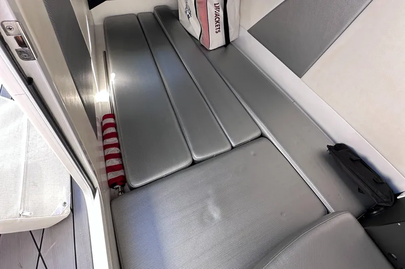 Slide: The Image of 2017 Sunsation 32 CCX interior with sleek silver seating and striped cushion. - 28