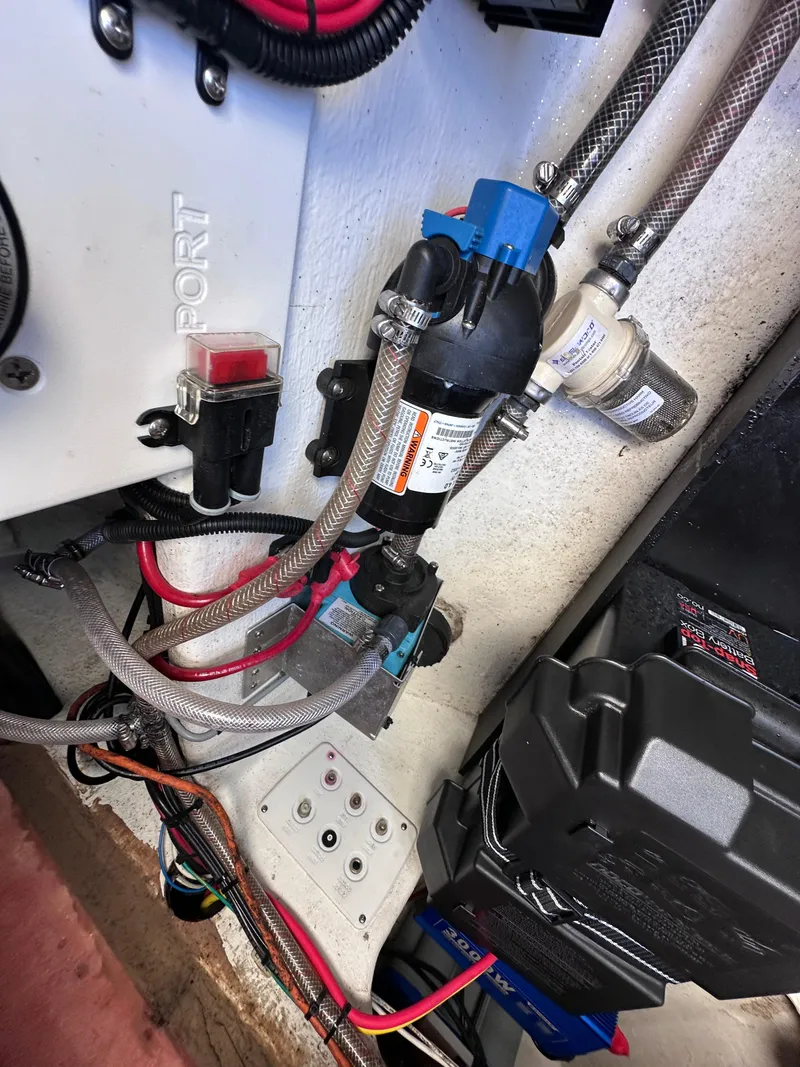 Slide: The Image of 2017 Sunsation 32 CCX boat wiring and plumbing components in engine compartment. - 33