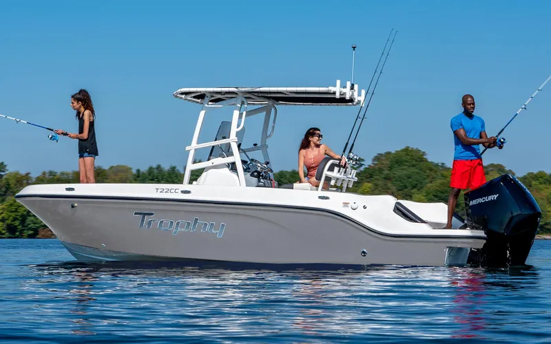 Slide: The Image of 2025 Bayliner Trophy T22CC boat with people fishing on calm water. - 14