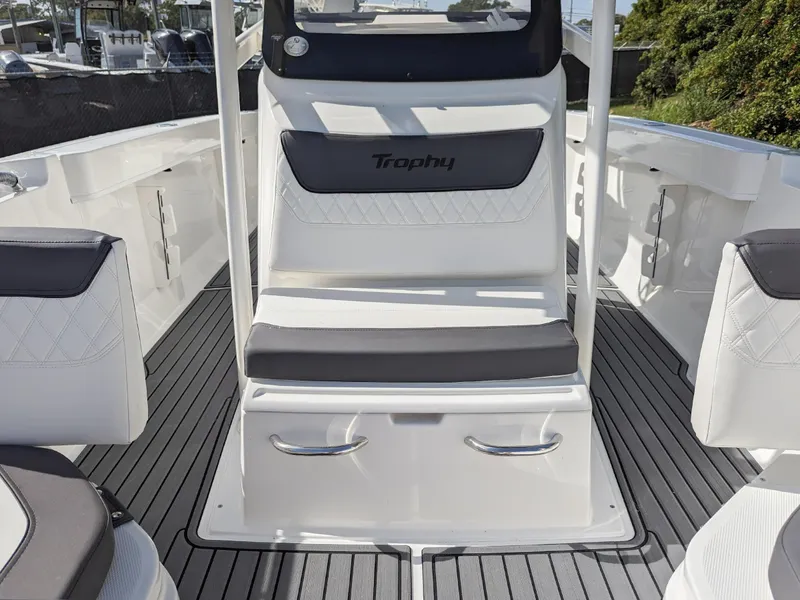 Slide: The Image of 2025 Bayliner Trophy T22CC boat interior with sleek seating and modern design. - 9