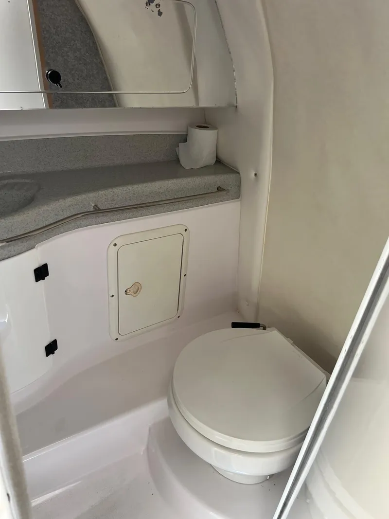 Slide: The Image of 1998 Donzi 33ZX boat bathroom with toilet and countertop. - 13