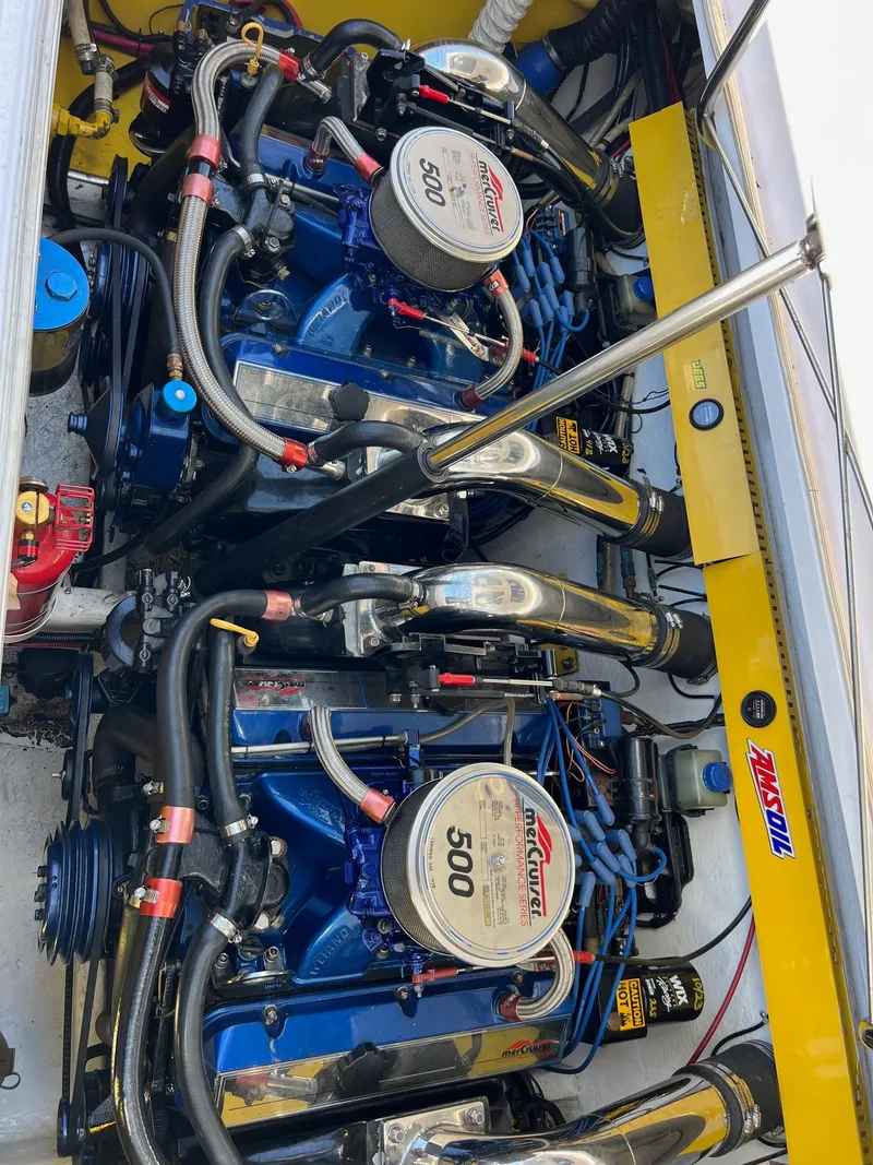 Slide: The Image of Twin engines in a 1998 Donzi 33ZX boat, showcasing powerful mechanical components. - 17