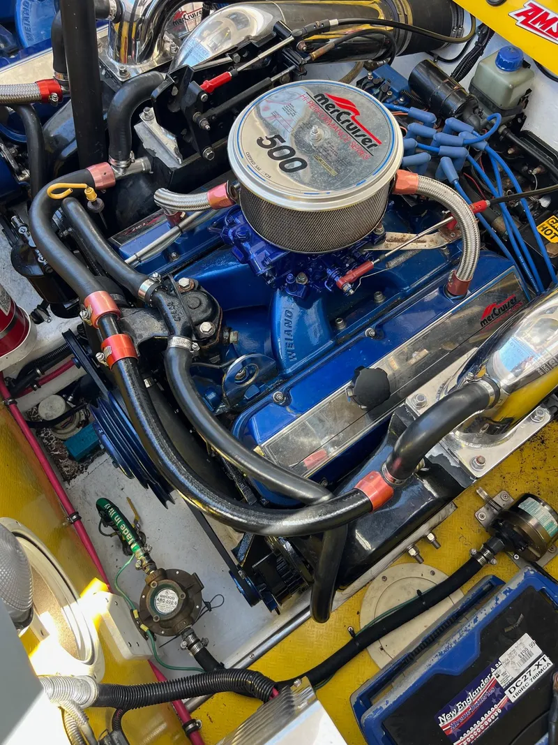 Slide: The Image of Engine of a 1998 Donzi 33ZX boat, featuring a high-performance setup with visible wiring and components. - 18