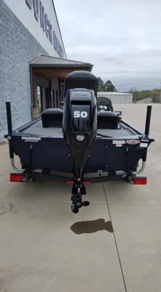Slide: The Image of 2019 Tracker Pro 170 boat with a 50 HP motor, parked outdoors. - 10