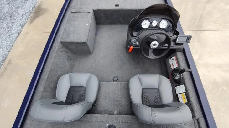 Slide: The Image of 2019 Tracker Pro 170 boat interior with dual seats and steering console. - 6