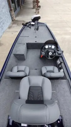 Slide: The Image of 2019 Tracker Pro 170 boat interior with gray seating and control panel. - 8