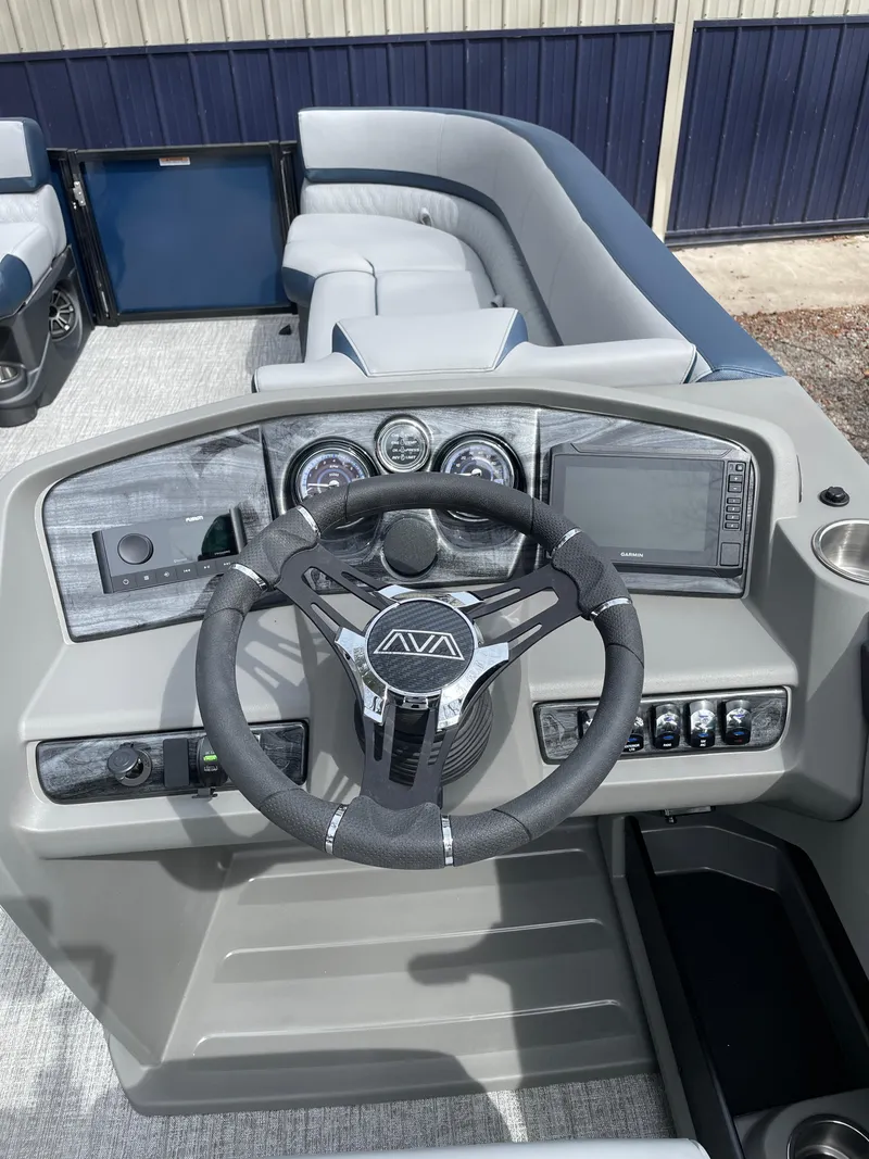 Slide: The Image of Steering console of 2025 Avalon 25 LSZ Elite pontoon boat with modern controls and gauges. - 2