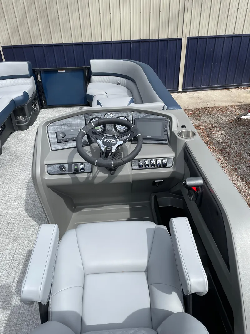 Slide: The Image of 2025 Avalon 25 LSZ Elite boat interior with modern steering and seating. - 3