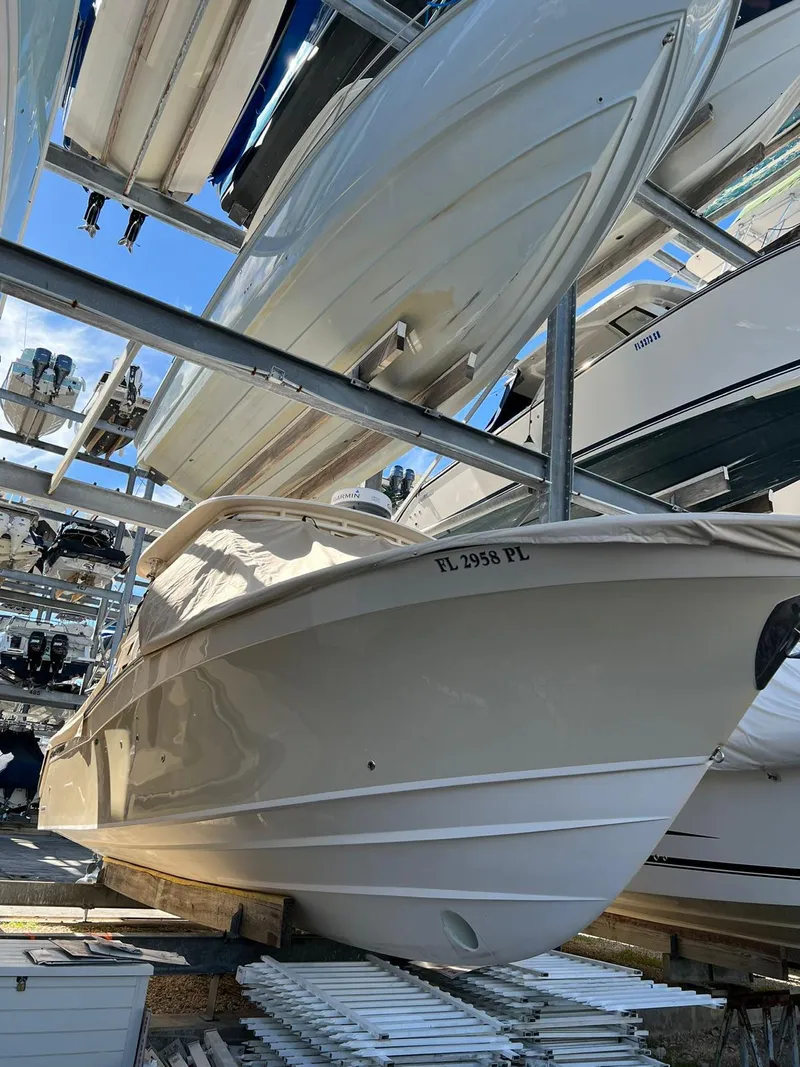 Slide: The Image of 2013 Grady-White Freedom 335 boat stored in a marina rack. - 2