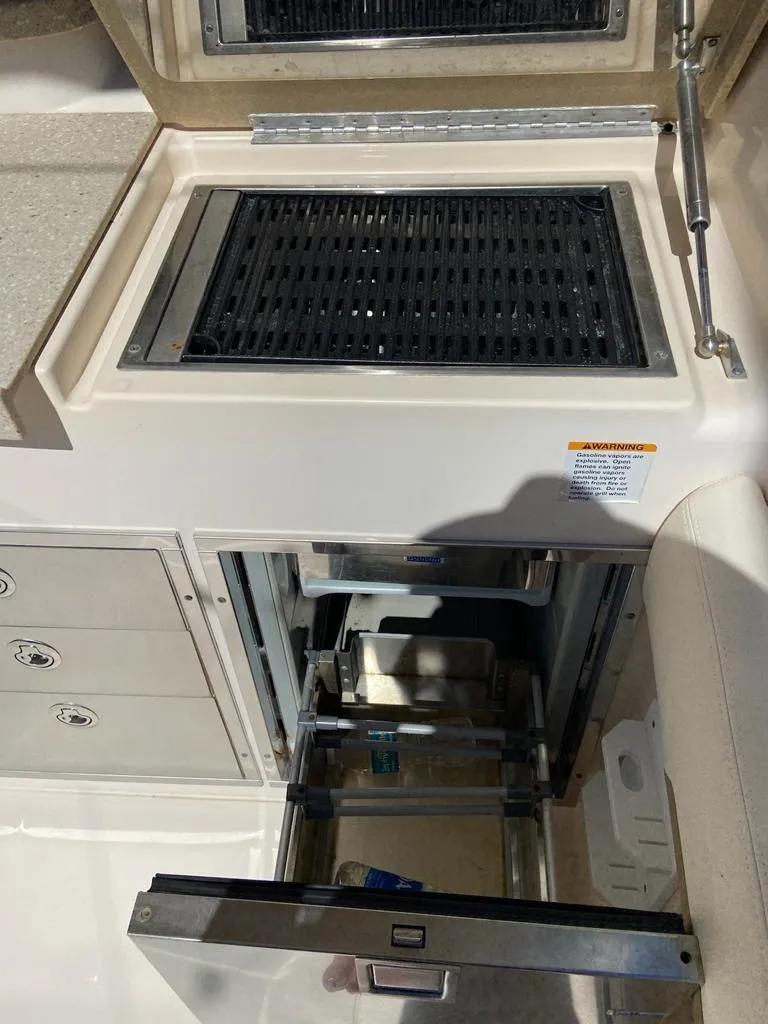 Slide: The Image of Grady-White Freedom 335 boat grill and storage area, 2013 model. - 9