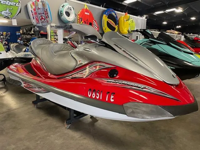 Slide: The Image of 2005 Yamaha WaveRunner FX Cruiser HO in showroom, red and silver design, displayed indoors. - 1