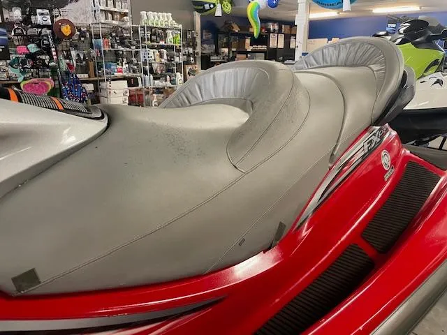 Slide: The Image of 2005 Yamaha WaveRunner FX Cruiser HO with red and gray seating in a store display. - 6