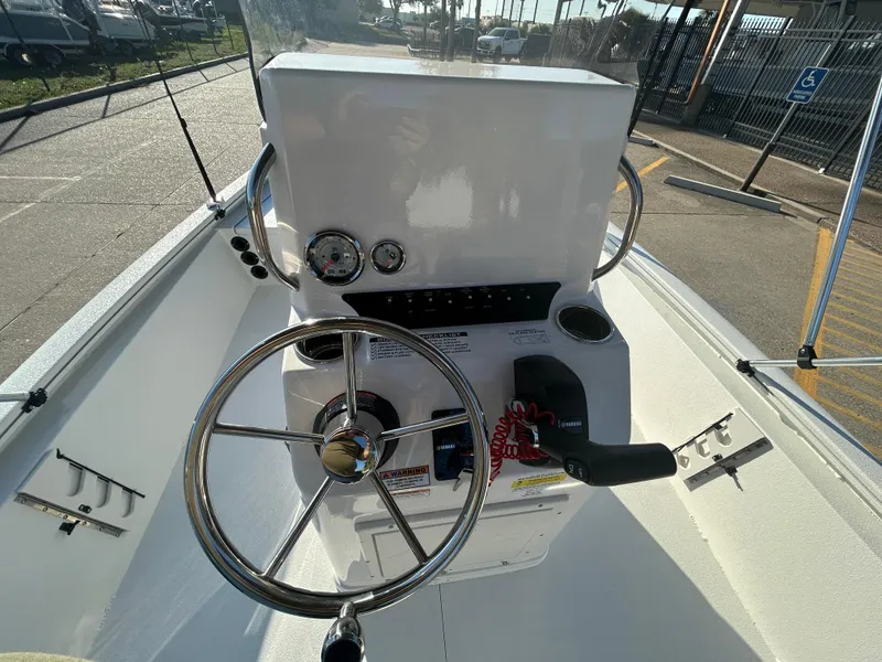 Slide: The Image of Steering console of 2025 Avid 19 FSX boat with gauges and controls. - 16