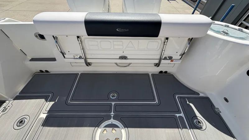 Slide: The Image of 2021 Robalo R302 Center Console boat deck with seating and storage. - 24