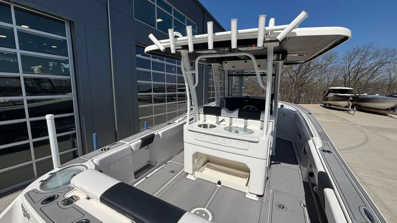 Slide: The Image of 2021 Robalo R302 Center Console boat with spacious deck and modern design. - 31