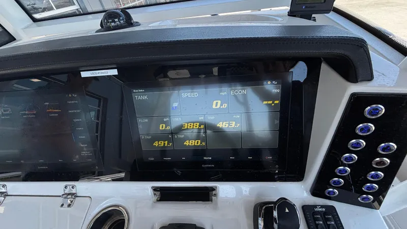 Slide: The Image of Dashboard of 2021 Robalo R302 Center Console boat with digital display and controls. - 40