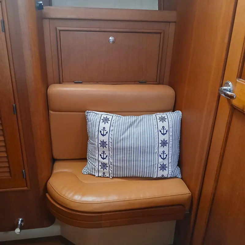 Slide: The Image of Cozy seating area with nautical-themed pillow on Island Packet 440, 2006 model. - 16