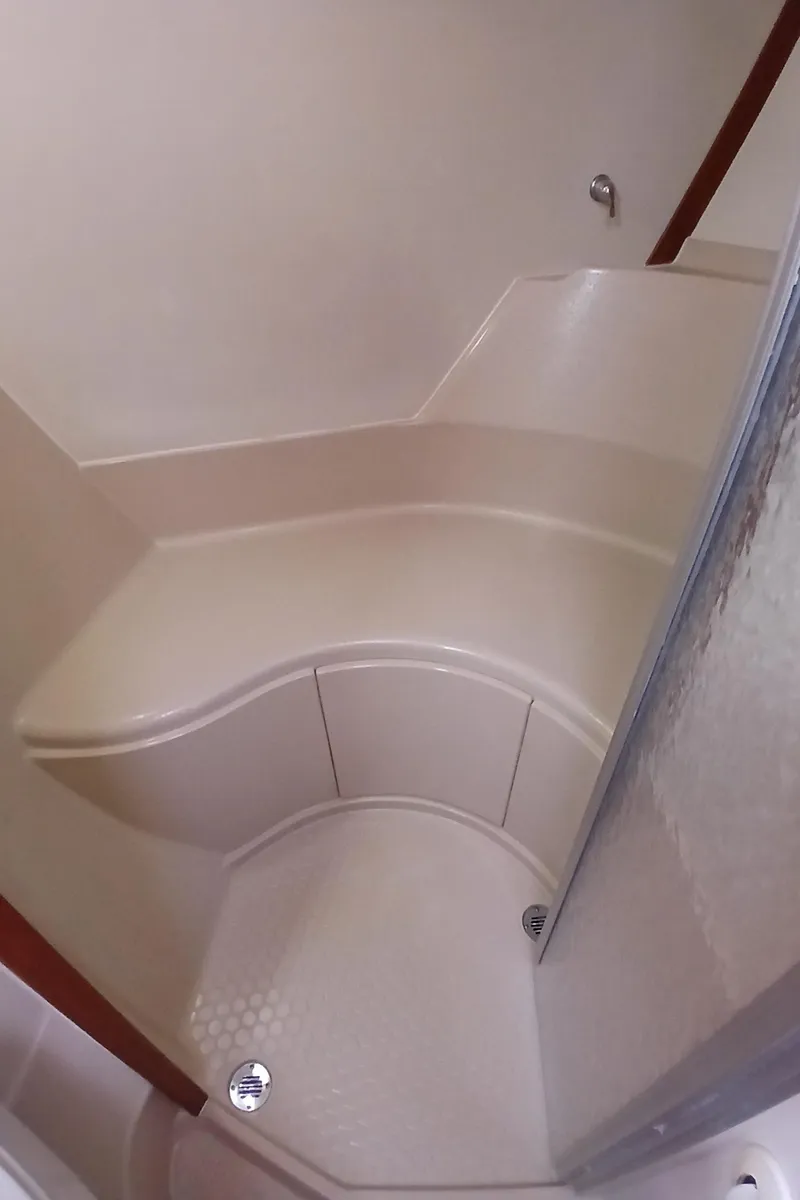 Slide: The Image of 2006 Island Packet 440 yacht interior shower with curved seating and modern design. - 20