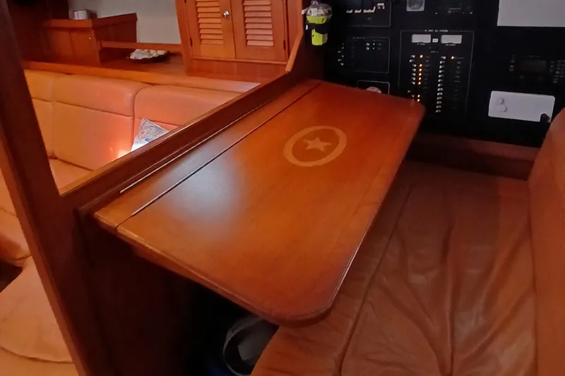 Slide: The Image of 2006 Island Packet 440 interior with wooden table and control panel. - 27