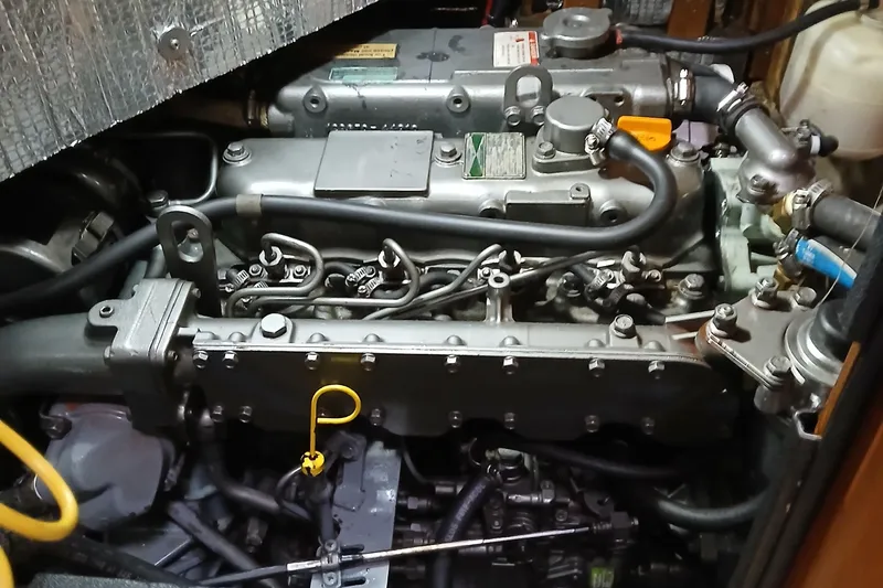 Slide: The Image of Engine compartment of a 2006 Island Packet 440 sailboat, showcasing detailed mechanical components. - 39