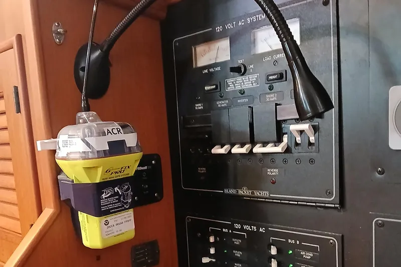 Slide: The Image of Electrical panel and emergency beacon on a 2006 Island Packet 440 yacht. - 43