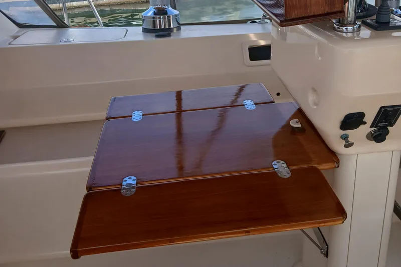Slide: The Image of Foldable wooden table on 2006 Island Packet 440 yacht deck. - 49