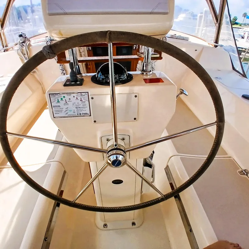Slide: The Image of Steering wheel of a 2006 Island Packet 440 sailboat cockpit. - 50