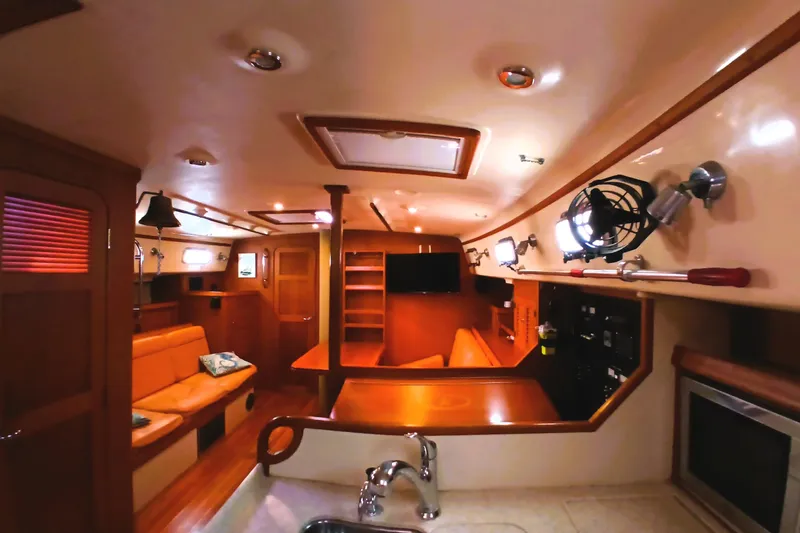 Slide: The Image of Interior of 2006 Island Packet 440 yacht, featuring cozy seating and modern amenities. - 6