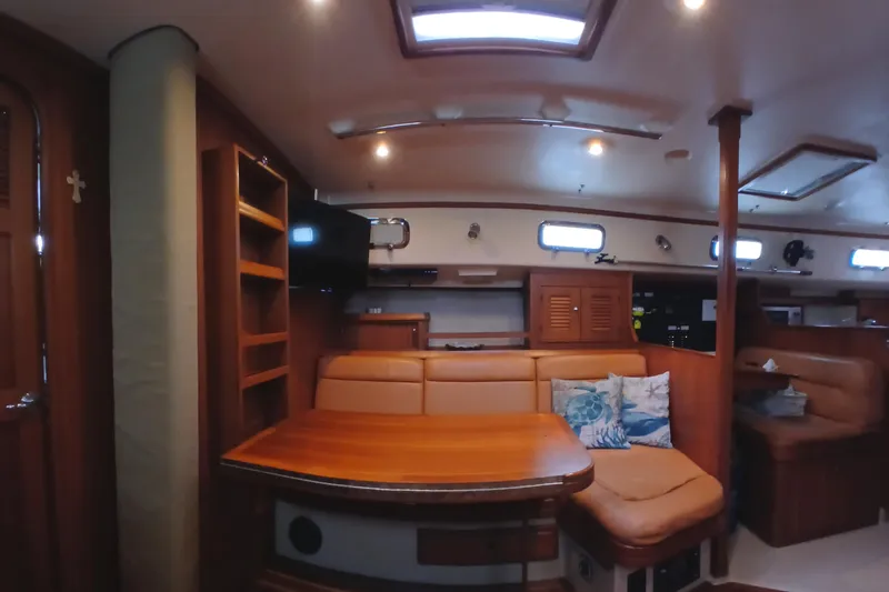 Slide: The Image of Interior of 2006 Island Packet 440 yacht with cozy seating and wooden furnishings. - 8