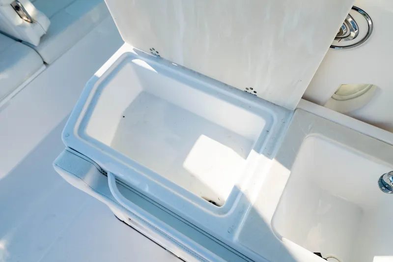 Slide: The Image of Open storage compartment on 2022 Edgewater 262 CX boat, showcasing interior space. - 13