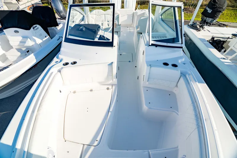 Slide: The Image of 2022 Edgewater 262 CX boat interior, featuring spacious seating and modern design. - 20