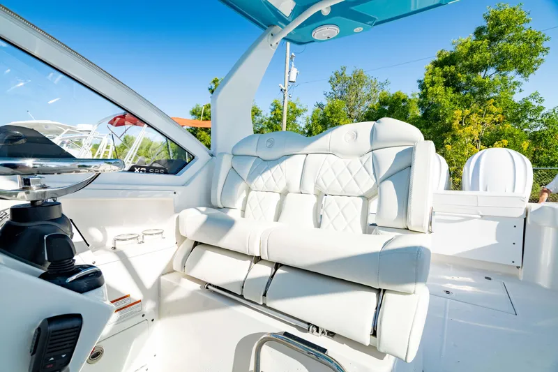 Slide: The Image of Luxurious interior of 2022 Edgewater 262 CX boat with plush seating and modern design. - 33
