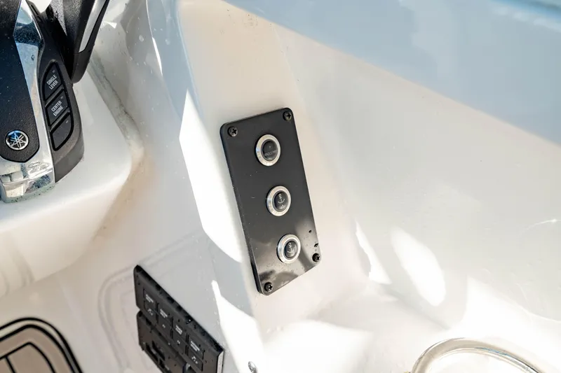 Slide: The Image of Control panel on 2022 Edgewater 262 CX boat interior. - 35