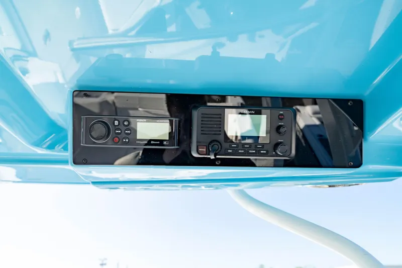 Slide: The Image of 2022 Edgewater 262 CX boat dashboard with electronic controls and displays. - 39
