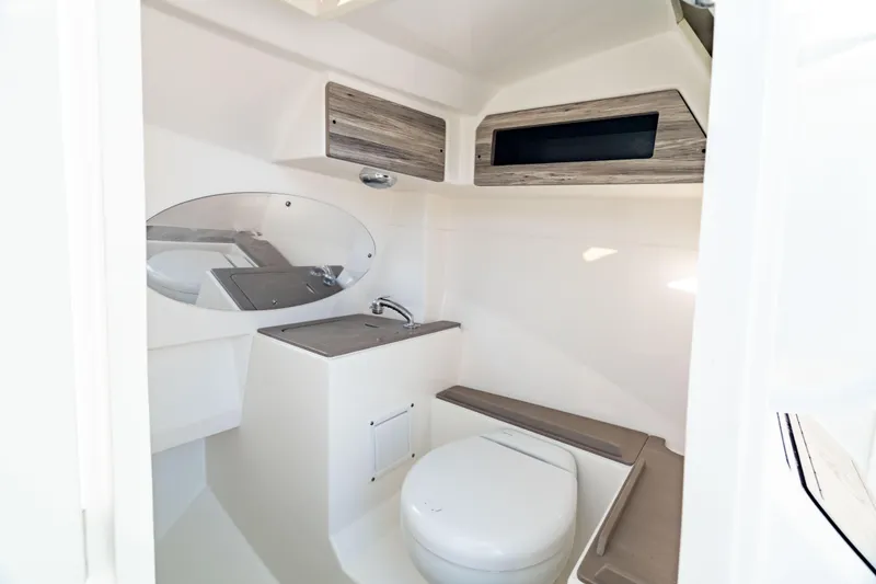 Slide: The Image of 2022 Edgewater 262 CX boat interior with modern bathroom amenities. - 4
