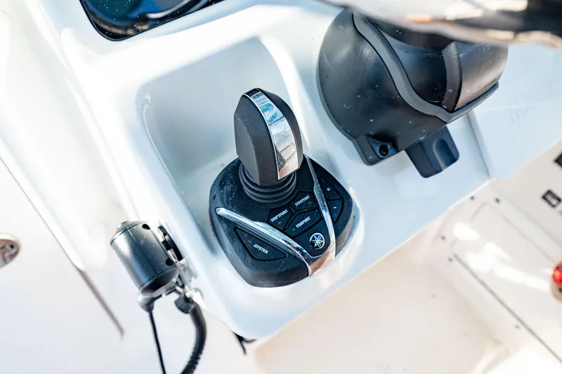 Slide: The Image of Joystick control on 2022 Edgewater 262 CX boat dashboard. - 6