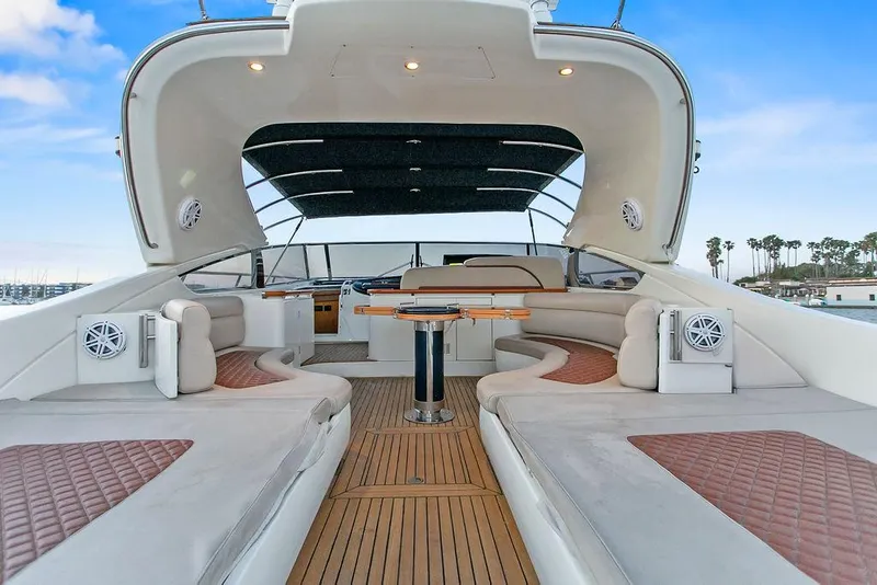 Slide: The Image of Luxurious 2004 Riva 59 Mercurius yacht interior with elegant seating and wooden flooring. - 13