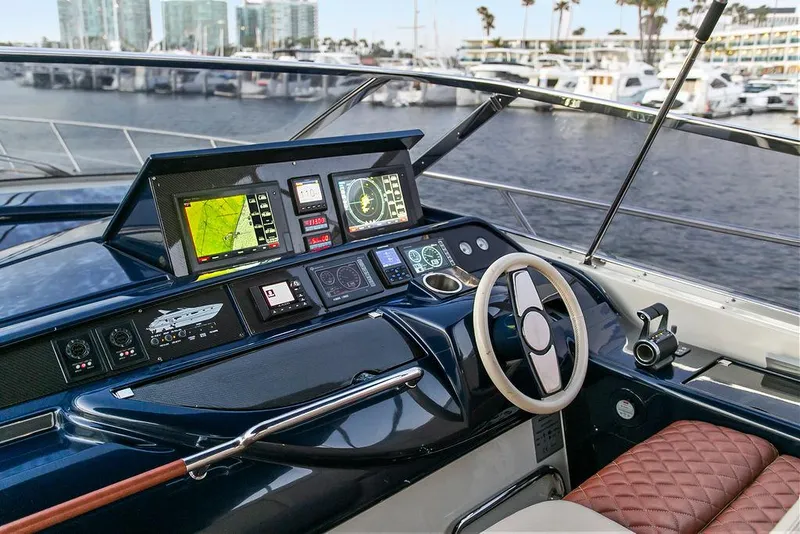Slide: The Image of Cockpit of 2004 Riva 59 Mercurius yacht with navigation screens and steering wheel. - 18